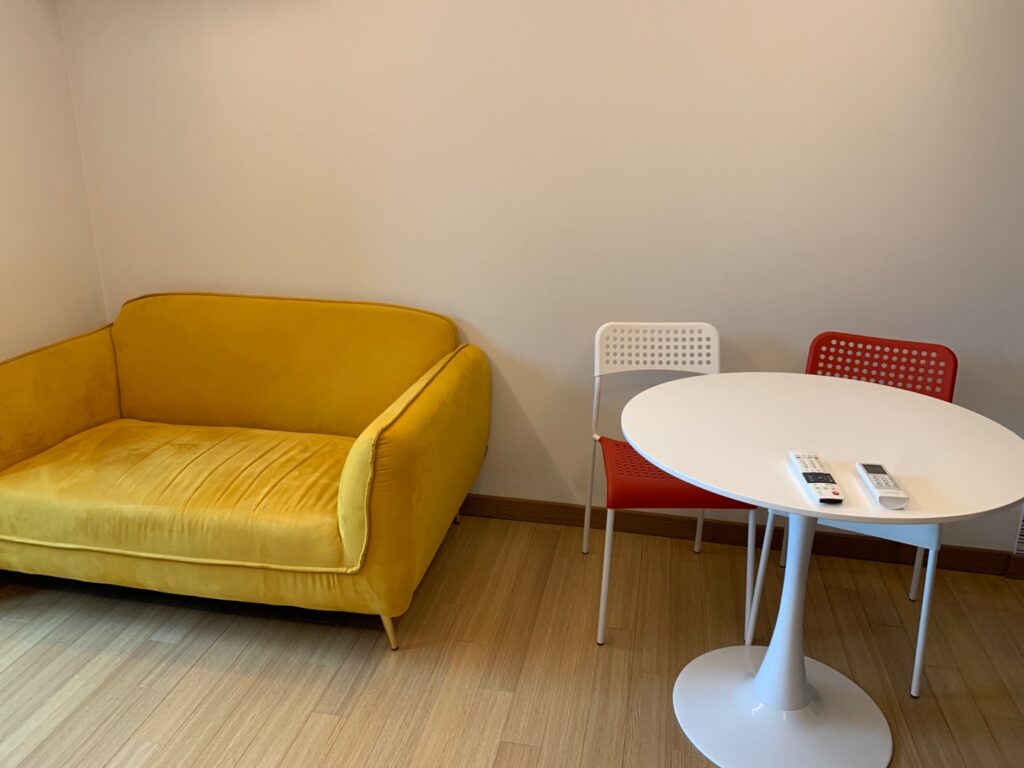 mustard sofa and ikea red-white chair