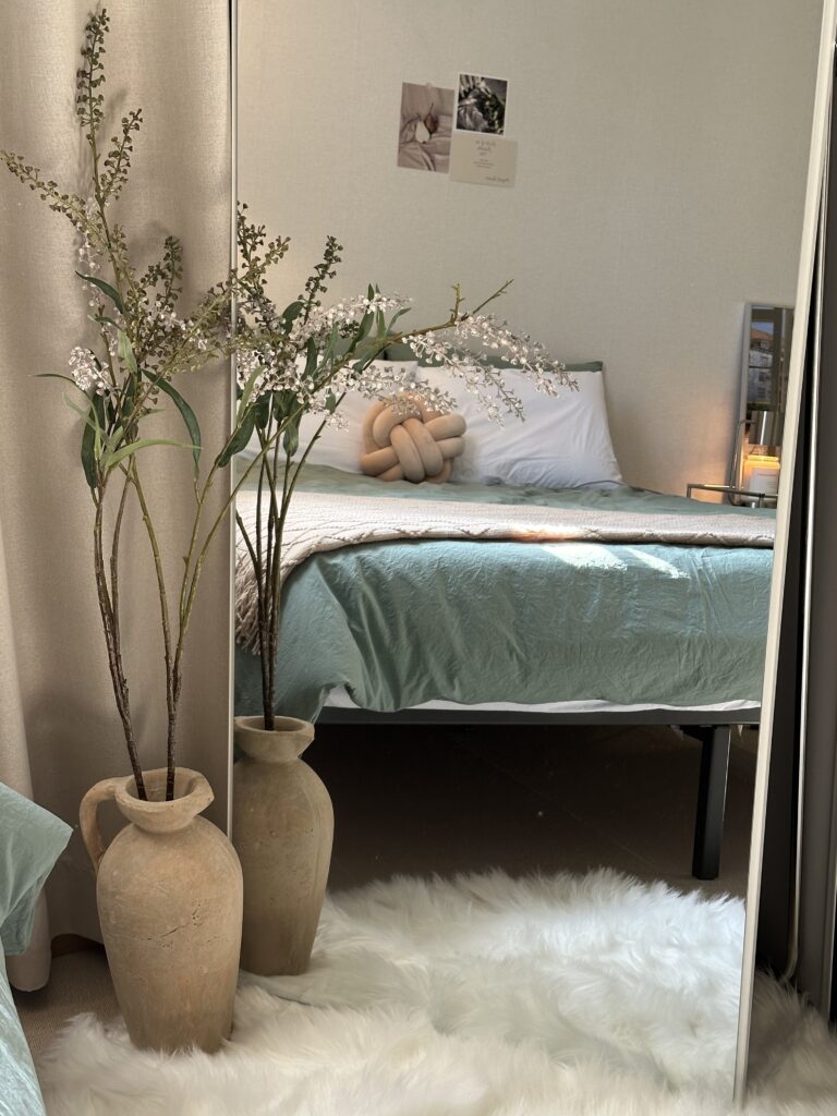 full length mirror facing guest bed