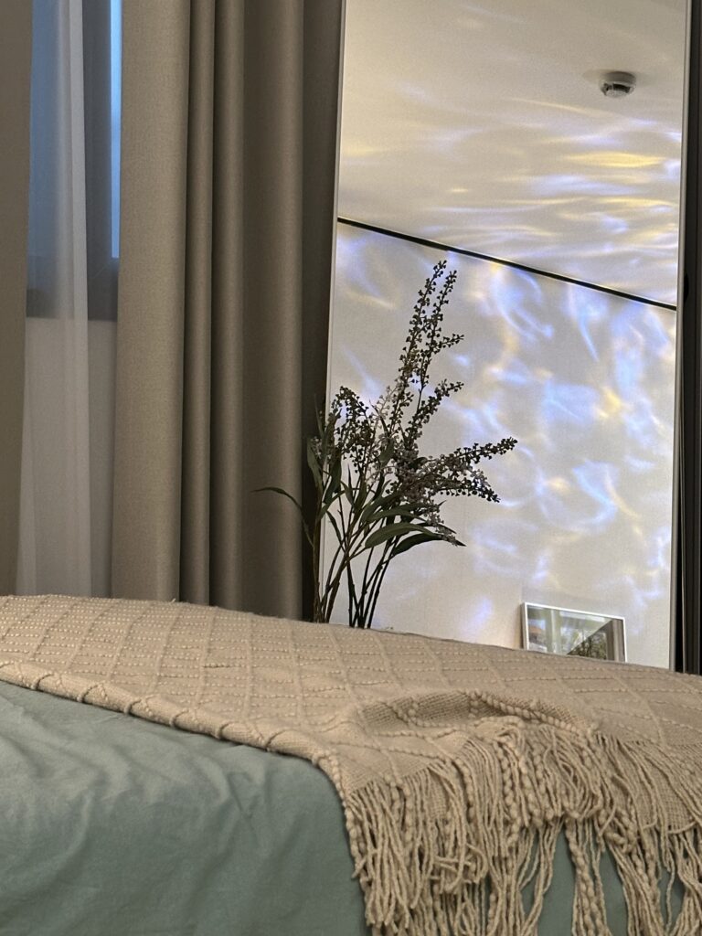 sage green bedsheet in guest bedroom